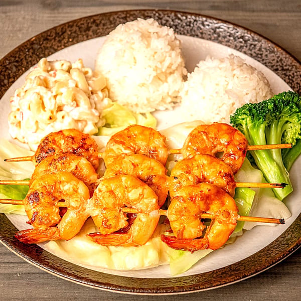 Hana Hawaiian BBQ plate with grilled shrimp skewers, macaroni salad, rice, and broccoli.