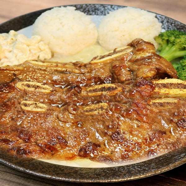 Hana Hawaiian BBQ plate with glistening short ribs, two scoops of rice, macaroni salad, and broccoli.