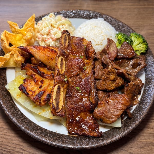 Hana Hawaiian BBQ plate with kalbi ribs, chicken, beef, rice, macaroni salad, wontons, and broccoli.